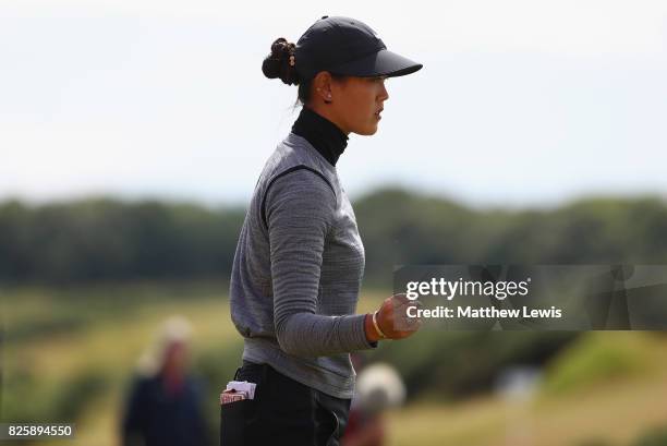 Michelle Wie of the United States celebrates her putt on the 18th green during the first round of the Ricoh Women's British Open at Kingsbarns Golf...