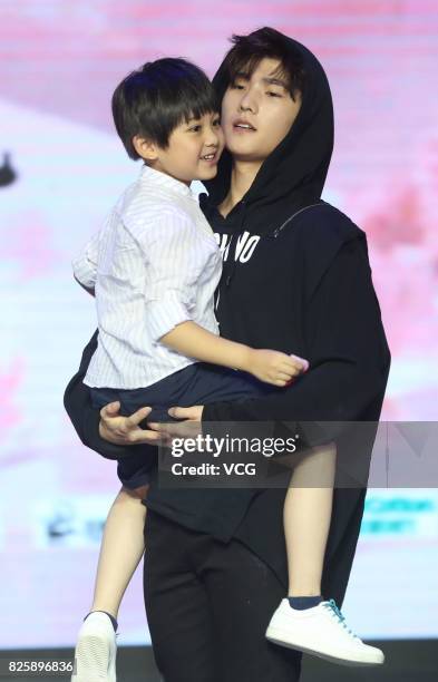 Actor Yang Yang and child star Peng Zisu attend the press conference of film "Once Upon a Time" on August 3, 2017 in Beijing, China.