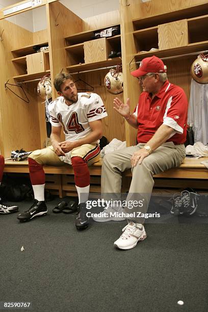 Mike Martz meets with J.T. O'Sullivan of the San Francisco 49ers in the locker room before the NFL game against the Chicago Bears at Soldier Field on...