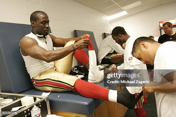 Thomas Clayton of the San Francisco 49ers is taped in the locker room before the NFL game against the Chicago Bears at Soldier Field on August 21,...