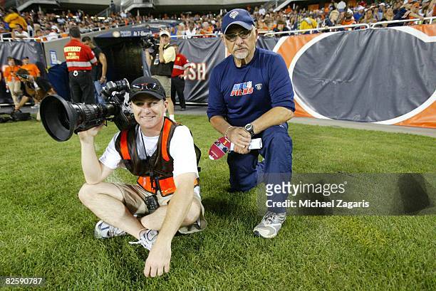 Crewmembers of NFL films work during the NFL game between the San Francisco 49ers and the Chicago Bears at Soldier Field on August 21, 2008 in...