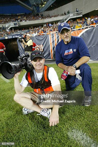 Crewmembers of NFL films work during the NFL game between the San Francisco 49ers and the Chicago Bears at Soldier Field on August 21, 2008 in...