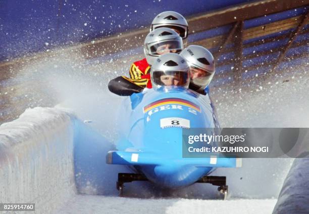 Three-time World championship medallist, German bobsleig pilot Andre Lange and his teammate Enrico Kuehn, Kevin Kuske and Carsten Embach break their...