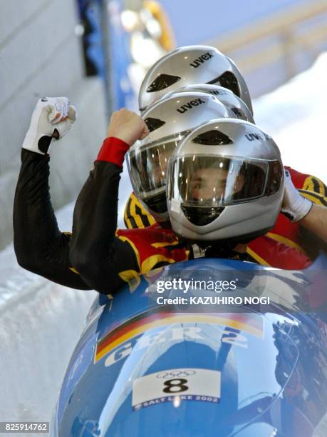 Three-time World championship medallist, German bobsleigh pilot Andre Lange and his teammate Enrico Kuehn, Kevin Kuske and Carsten Embach celebrate...