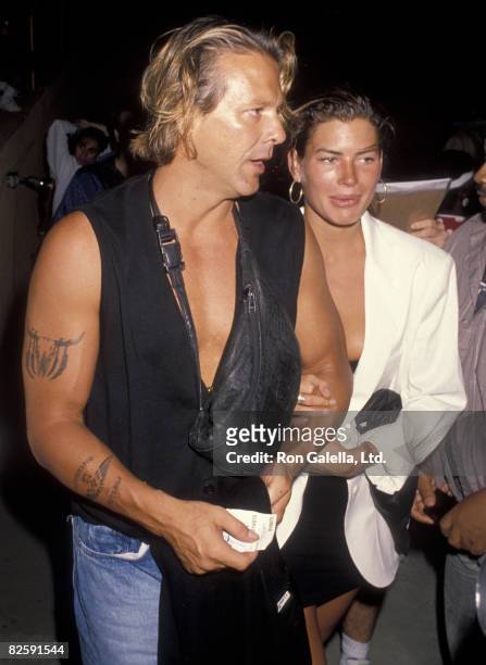 Actor Mickey Rourke and wife Carre Otis being photographed on July 8, 1990 at Roxbury Club in West Hollywood, California.