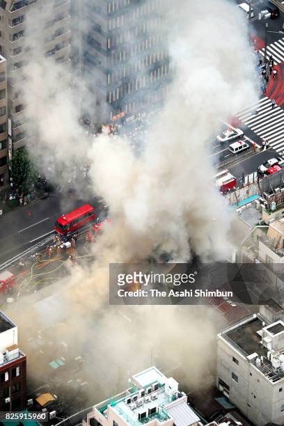 In this aerial image, a fire destroyed several buildings outside Tokyo's famed Tsukiji fish market on August 3, 2017 in Tokyo, Japan. The blaze in...