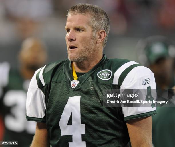 Brett Favre of the New York Jets watches on the sidelines during a pre-season NFL game against the Washington Redskins on August 16, 2008 in Giants...