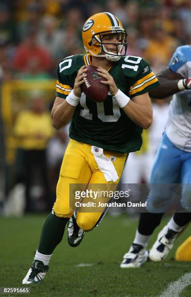 Matt Flynn of the Green Bay Packers rolls out to look for a receiver against the Tenessee Titans on August 28, 2008 at Lambeau Field in Green Bay,...