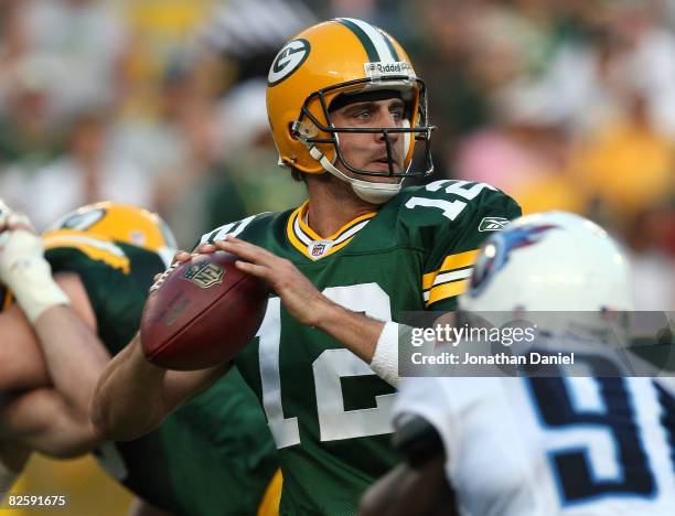 Aaron Rodgers of the Green Bay Packers looks for a receiver on his only play of the game, a touchdown pass to Greg Jennings, in the 1st quarter...