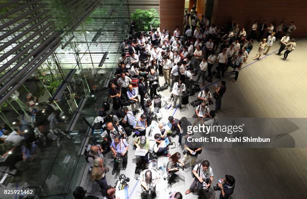 Media reporters and photographers gather at the entrance of the prime minister's official residence on August 3, 2017 in Tokyo, Japan. Prime Minister...