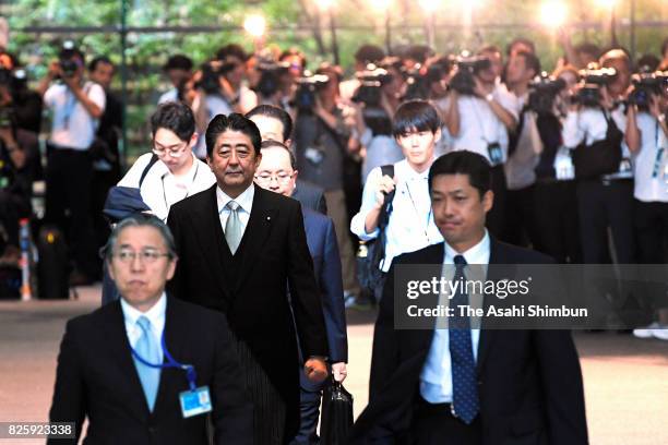 Prime Minister Shinzo Abe leaves for the Imperial Palace for the attestation ceremony at the prime minister's official residence on August 3, 2017 in...