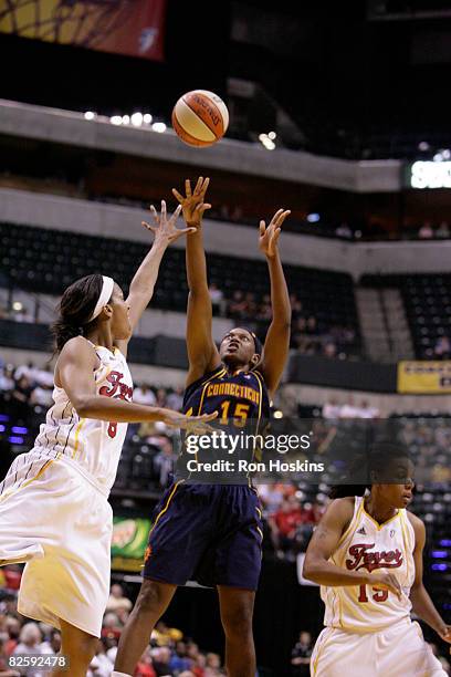 Asjha Jones of the Connecticut Sun shoots over Tammy Sutton-Brown of the Indiana Fever at Conseco Fieldhouse on August 28, 2008 in Indianapolis,...