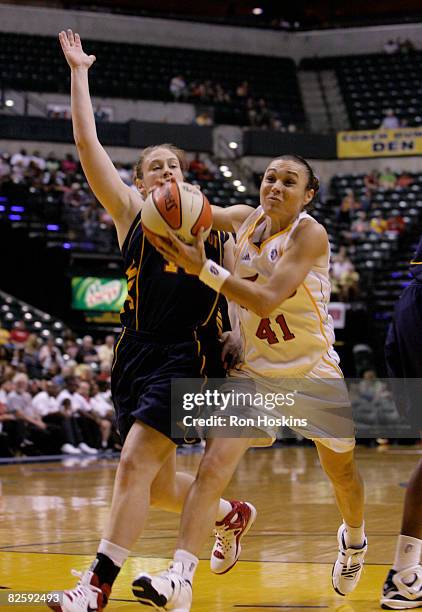 Tully Bevilaqua of the Indiana Fever drives on Lindsay Whalen of the Connecticut Sun at Conseco Fieldhouse on August 28, 2008 in Indianapolis,...