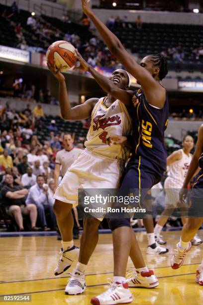 Doneeka Lewis of the Indiana Fever drives on Sandrine Gruda of the Connecticut Sun at Conseco Fieldhouse on August 28, 2008 in Indianapolis, Indiana....