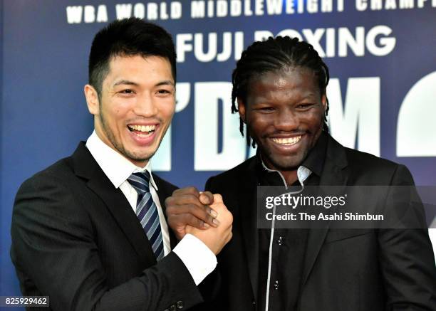 Ryota Murata and Hassan N'Dam pose for photographs during a press conference announcing the rematch of the WBA Middleweight title bout on August 3,...