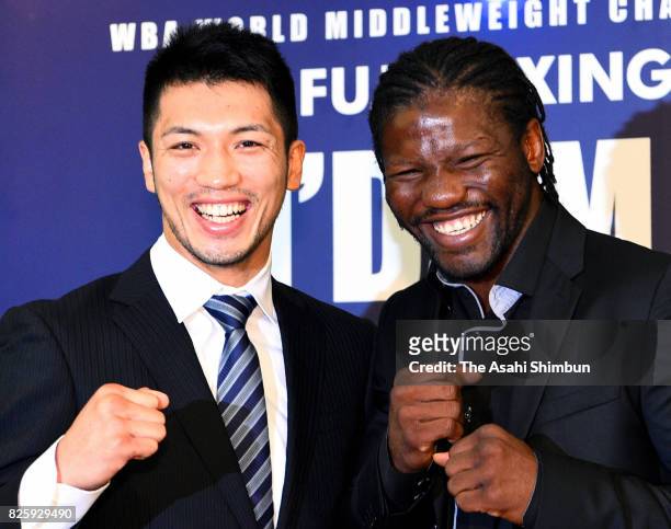 Ryota Murata and Hassan N'Dam pose for photographs during a press conference announcing the rematch of the WBA Middleweight title bout on August 3,...