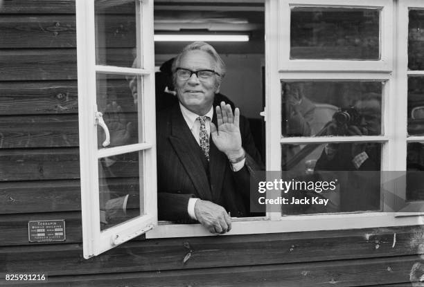 English actor and director Laurence Olivier posing for some photographers inside his National Theater office, London, 29th September 1970.