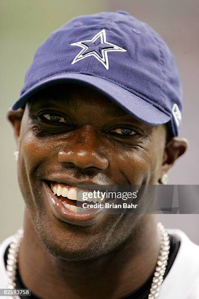 Wide receiver Terrell Owens of the Dallas Cowboys relaxes on the sidelines against the Minnesota Vikings during of a preseason game on August 28,...