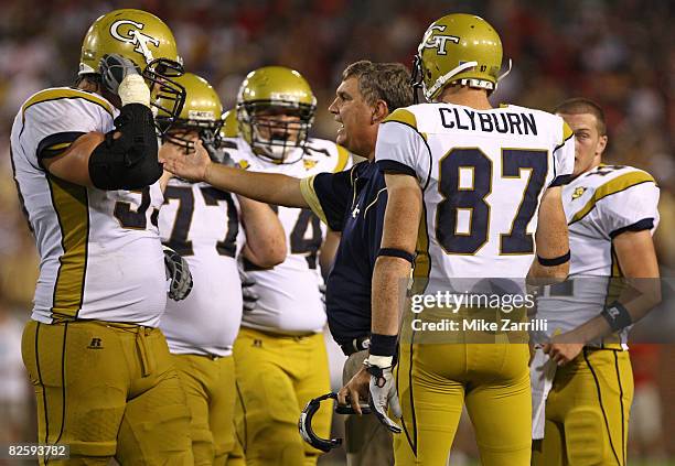 Head coach Paul Johnson of the Georgia Tech Yellow Jackets addresses R.B. Clyburn and other members of the offense during the game against the...