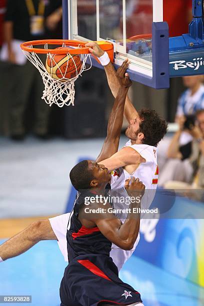 Rudy Fernandez of Spain dunks against Dwight Howard of the United States during the gold medal game at the 2008 Beijing Summer Olympics at the...