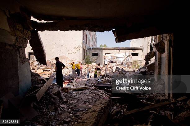 Georgian families visit the remains of their homes that were bombed by Russian aircraft August 28, 2008 in Gori, Georgia. As Russian President Dmitri...