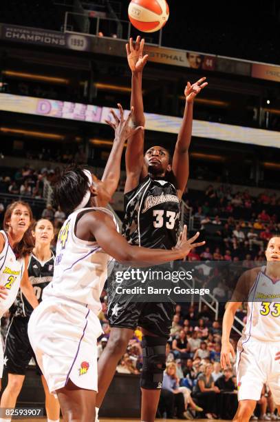 Sophia Young of the San Antonio Silver Stars shoots against Barbara Farris of the Phoenix Mercury on August 28, 2008 at U.S. Airways Center in...