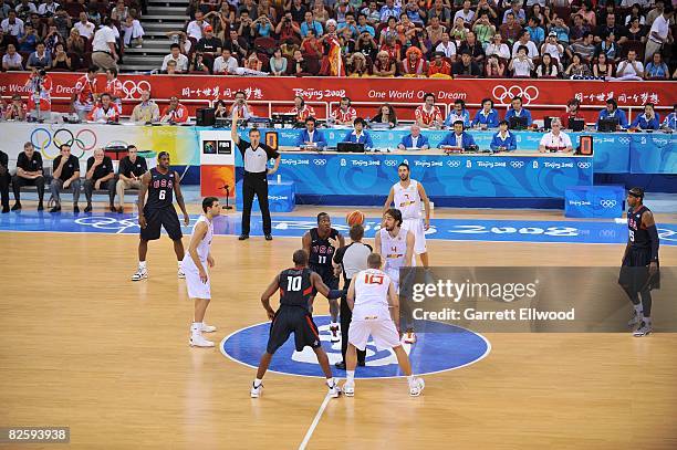 Dwight Howard of the United States and Pau Gasol of Spain line up for the jump ball during the gold medal game at the 2008 Beijing Summer Olympics at...