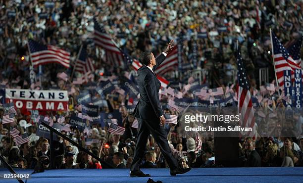 Democratic U.S. Presidential nominee Sen. Barack Obama waves to the crowd after his speech on day four of the Democratic National Convention at...
