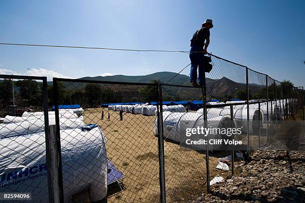 Georgian IDP families adjust to daily life at a tent city August 28, 2008 in Gori, Georgia. During the day, various humanitarian aid organizations...