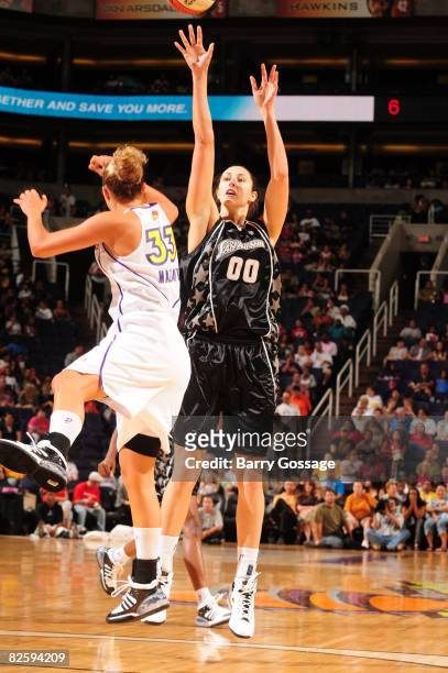 Ruth Riley of the San Antonio Silver Stars shoots against Kelly Mazzante of the Phoenix Mercury on August 28 at U.S. Airways Center in Phoenix,...