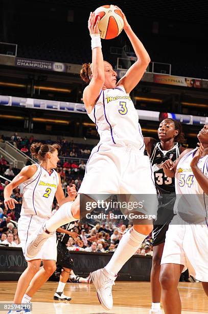 Diana Taurasi of the Phoenix Mercury grabs a rebound against the San Antonio Silver Stars on August 28 at U.S. Airways Center in Phoenix, Arizona....