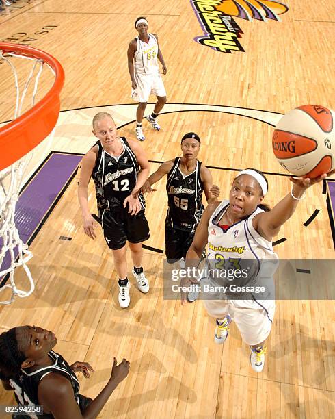 Cappie Pondexter of the Phoenix Mercury shoots against Sophia Young of the San Antonio Silver Stars on August 28 at U.S. Airways Center in Phoenix,...
