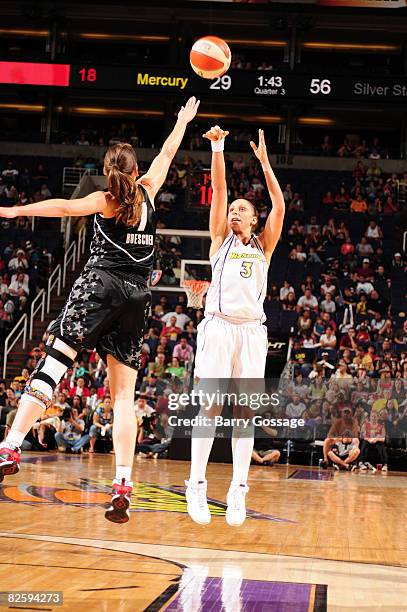 Diana Taurasi of the Phoenix Mercury shoots against Erin Buescher of the San Antonio Silver Stars on August 28 at U.S. Airways Center in Phoenix,...