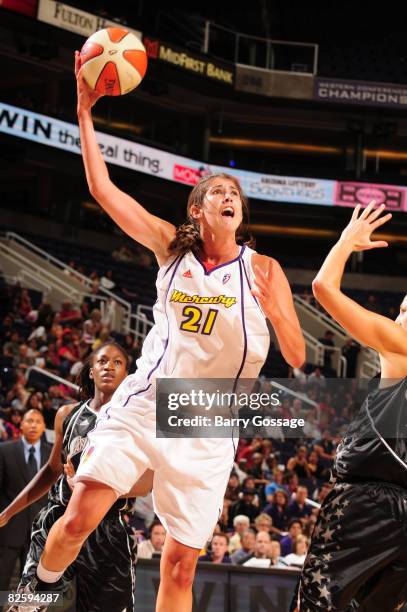 Brooke Smith of the Phoenix Mercury shoots against the San Antonio Silver Stars on August 28 at U.S. Airways Center in Phoenix, Arizona. NOTE TO...