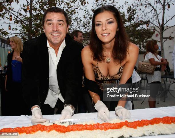 Actor Christopher Knight and model Adrianne Curry roll a tuna roll at the Grand Opening Celebration For Sashi: Sushi + Sake Lounge on August 28, 2008...
