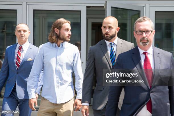 David Butt, lawyer for Christian Theriault, Christian Theriault, Const. Michael Theriault and his lawyer Michael Lacy. OSHAWA, ON - AUGUST 2 - Const....