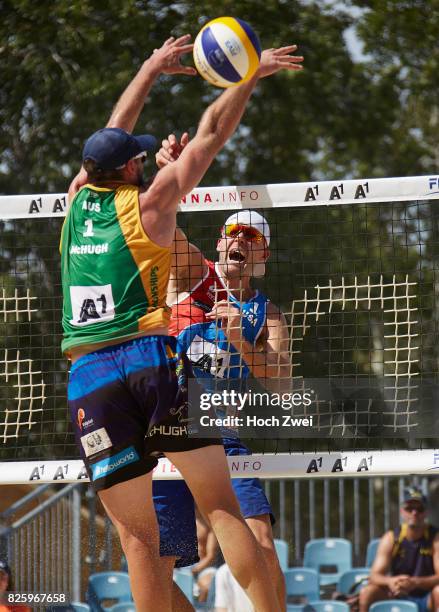 Christopher McHugh of Australia competes against Jake Gibb of the United States during Day 7 of the FIVB Beach Volleyball World Championships 2017 on...