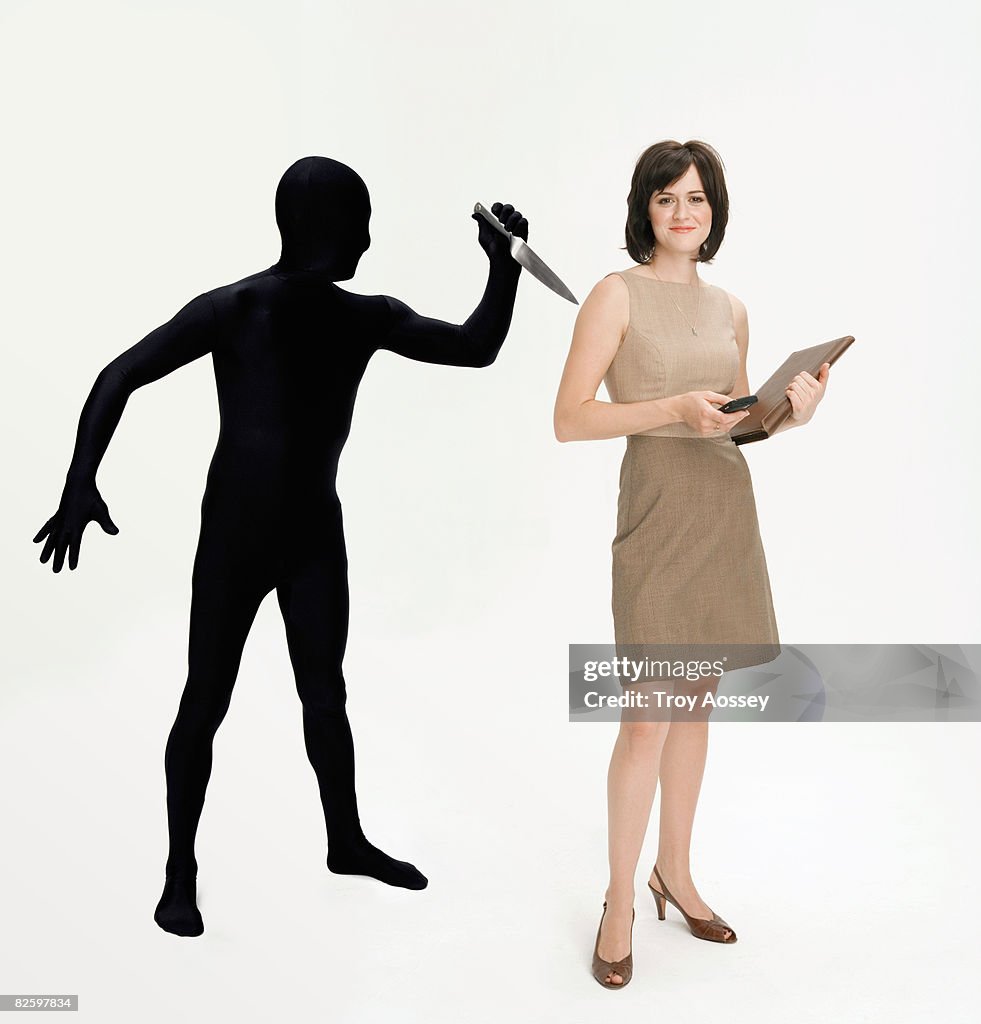Business woman with backstabber.