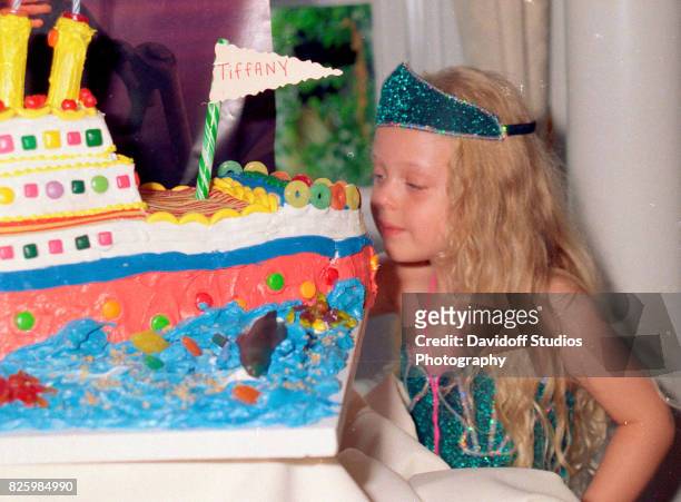 View of Tiffany Trump as she looks at 'Titanic'-themed cake during her fifth birthday party at the Mar-a-Lago estate, Palm Beach, Florida, October...
