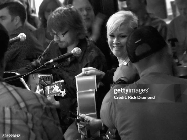 Guitarist Todd Woolsey and Singer/Songwriter Lorrie Morgan perform during "An Intimate Night With The Morgans" Lorrie Morgan, Marty Morgan And Guests...