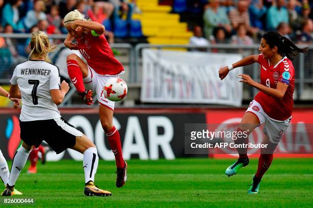 Denmark's forward Nadia Nadim vies for the ball with Austria's defender Viktoria Schnaderbeck during the UEFA Womens Euro 2017 football tournament...