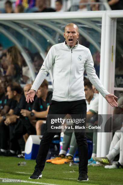 Head Coach Zinedine Zidane of Real Madrid yells from the sideline during the International Champions Cup El Clásico match between FC Barcelona and...