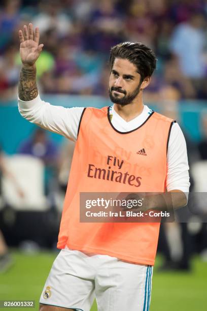 Isco of Real Madrid waves to fans during the International Champions Cup El Clásico match between FC Barcelona and Real Madrid at the Hard Rock...