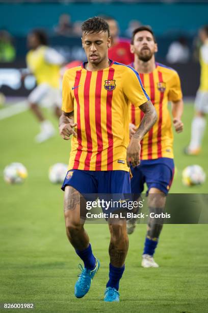 Neymar of Barcelona and Lionel Messi of Barcelona run drills for warm ups during the International Champions Cup El Clásico match between FC...