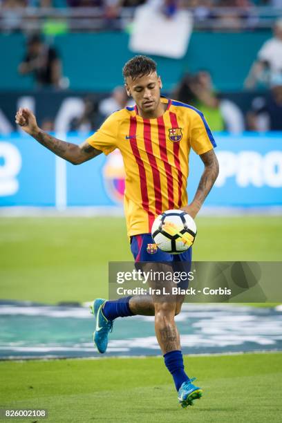 Neymar of Barcelona kicks the ball during warm ups during the International Champions Cup El Clásico match between FC Barcelona and Real Madrid at...