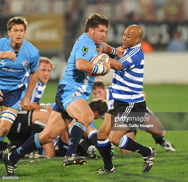 Derick Kuun of Blue Bulls is tackled by Bolla Conradie of Western Province during the Absa Currie Cup match between Vodacom Blue Bulls and Vodacom...