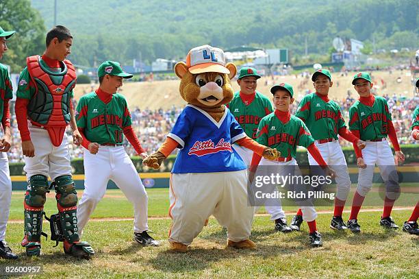 The mascots dance with the players before the game between the Waipio Little League team from Waipio, Hawaii and the Matamoros Little League from...