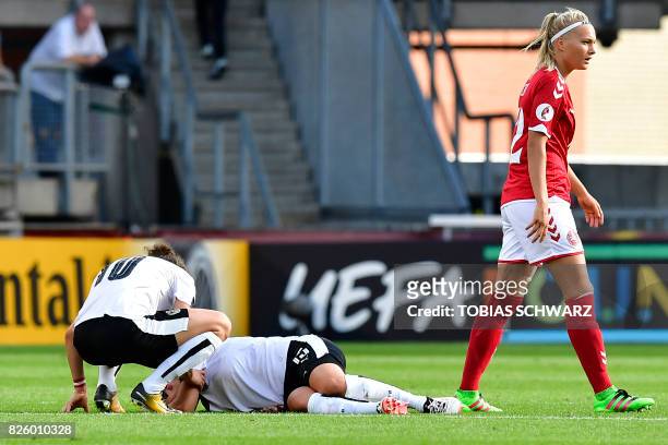Austria's forward Nicole Billa lies on the pitch during the UEFA Womens Euro 2017 football tournament semi-final match between Denmark and Austria at...