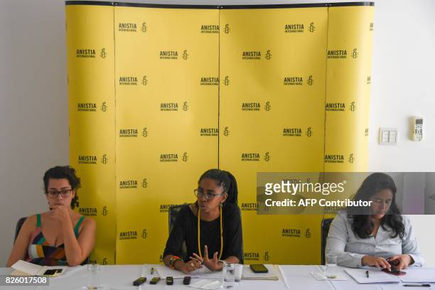 Jurema Werneck, executive director of Amnesty Internacional Brazil speaks next to Laura Molinari, activist of sexual and reproductive rights group...