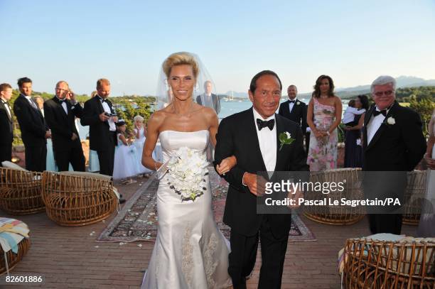 Singer Paul Anka and Anna Anka walk their first few steps as husband and wife just after exchanging their vows at Hotel Cala di Volpe on July 26,...
